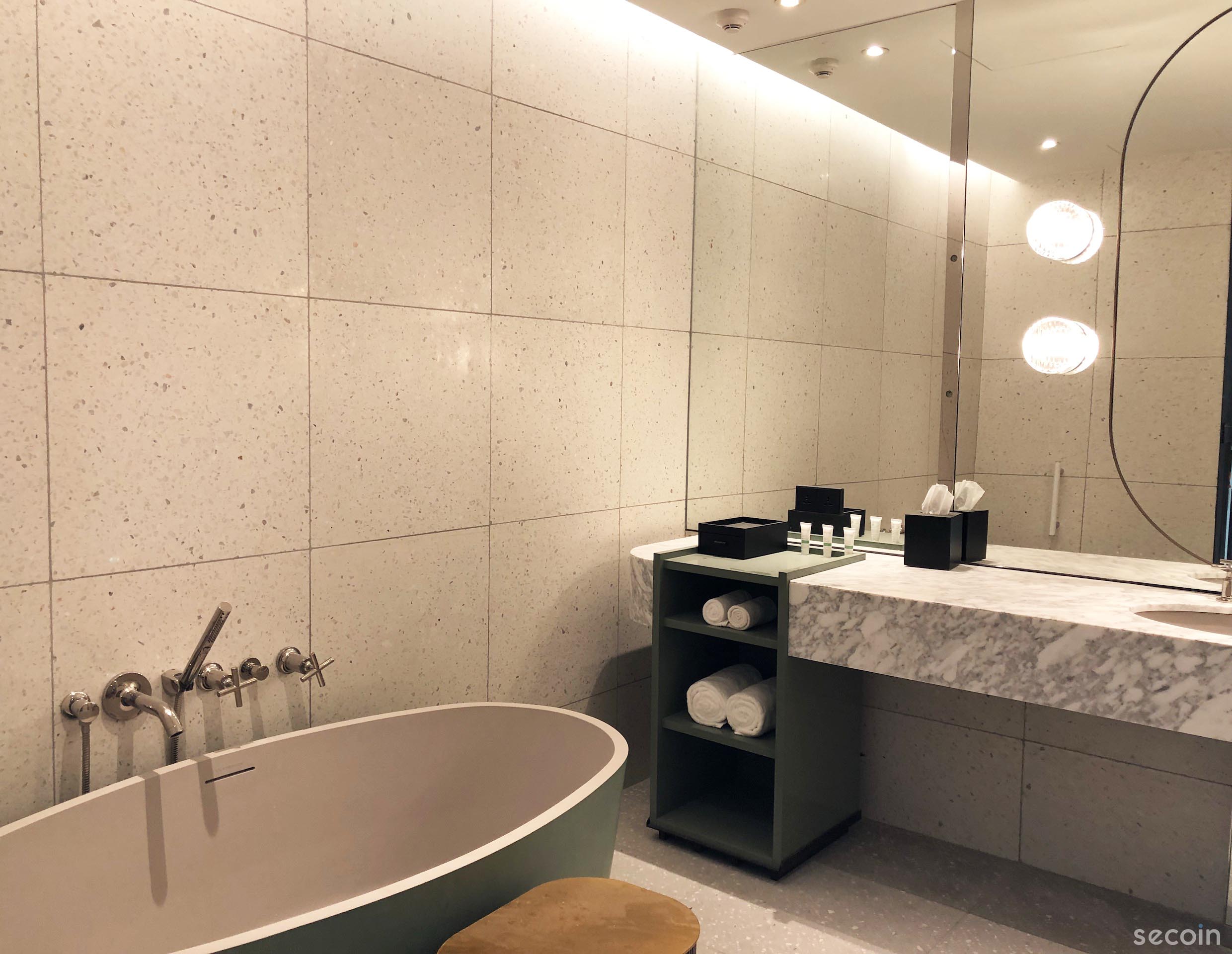 Under the yellow light, the stone chips Terrazzo tiles are even more charming